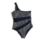 Summer beach women's one-piece swimsuit with black and gray shimmering pattern.