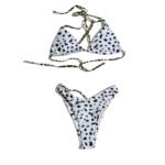 Summer beach women's two-piece swimsuit with black and white polka dot cow print.